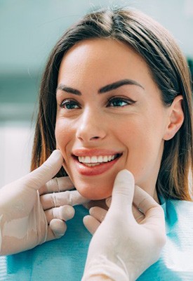Dentist examining a patient’s smile