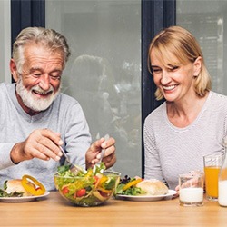 an older couple enjoying a healthy meal together