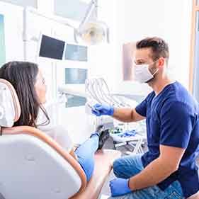 Dentist and patient talking in dental office